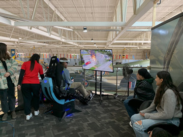Students inside an airplane at the Warplane museum